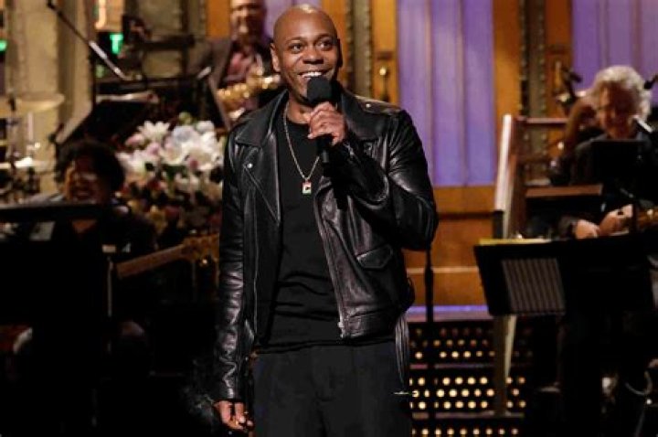 Dave Chappelle Makes Guest Appearance On John Mulaney’s Show And Catches Fire With The Trans Community Once More